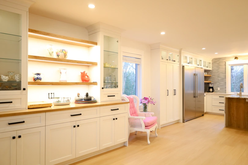 Open-shelf cabinetry with glass display cabinets